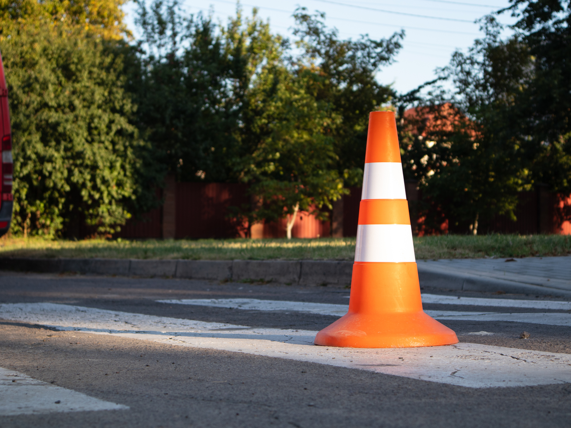Bright orange traffic cone on residential street