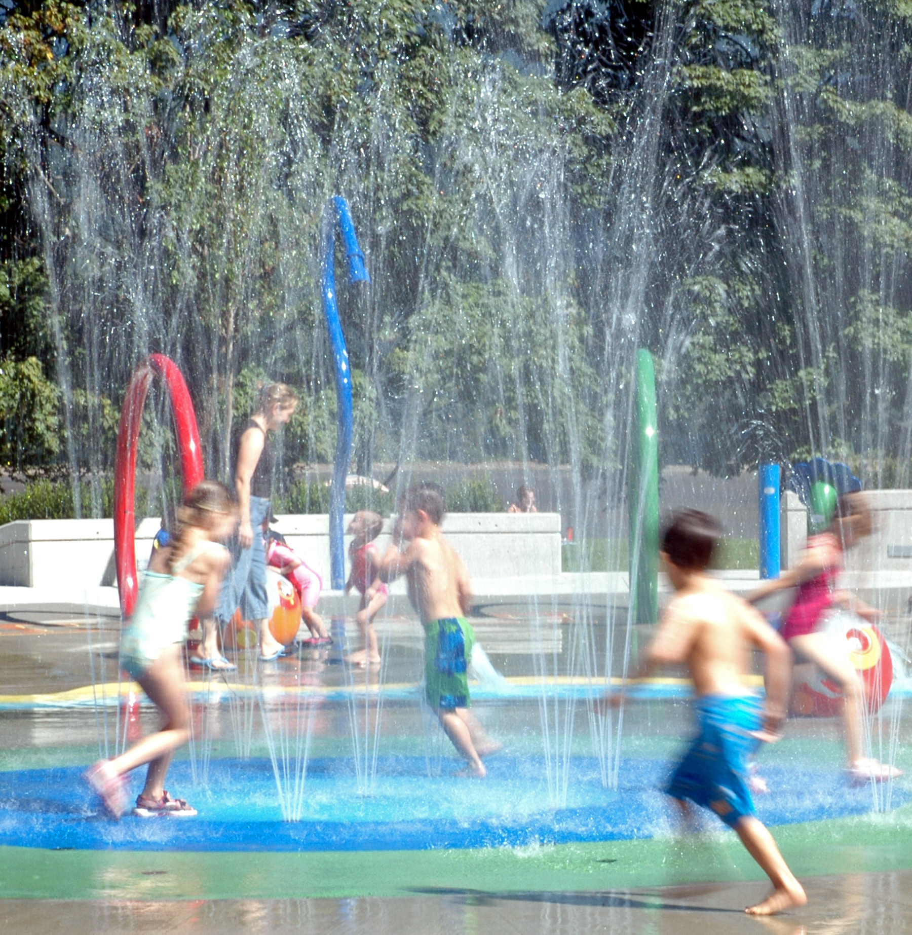 Kids running in a water park